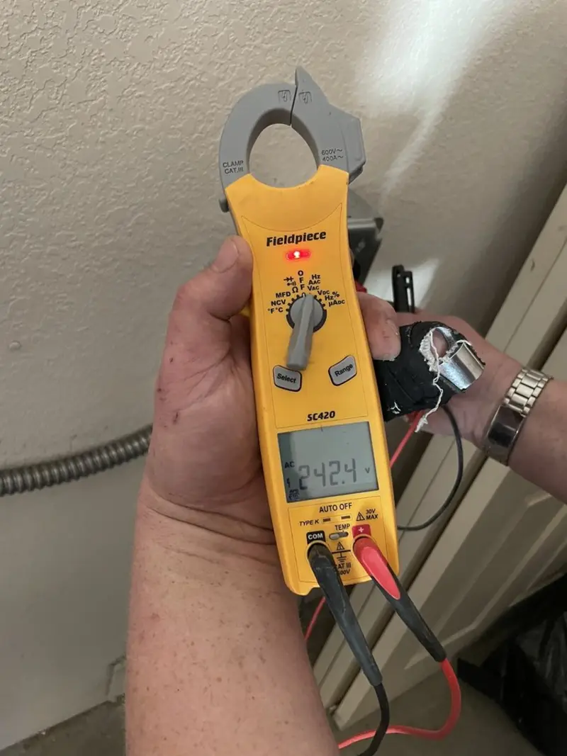 Voltage testing with clamp meter during Generator Installation in Villa Park